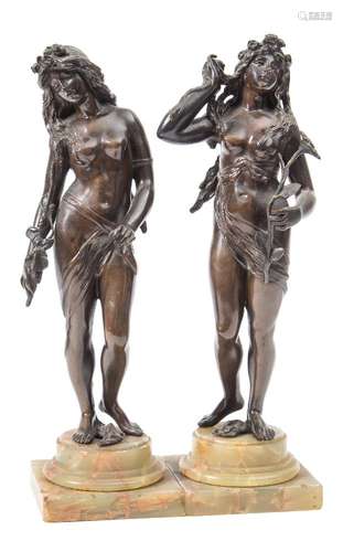 A pair of Art Nouveau bronze female nudes: possibly depicting Flora and Fauna,