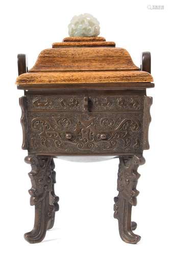 A Chinese archaic-style bronze censer: of rectangular section with flattened loop handles,