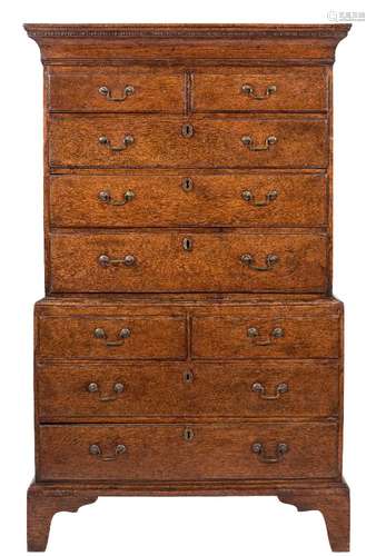 A George III oak chest on chest:, the upper part with a moulded cornice,