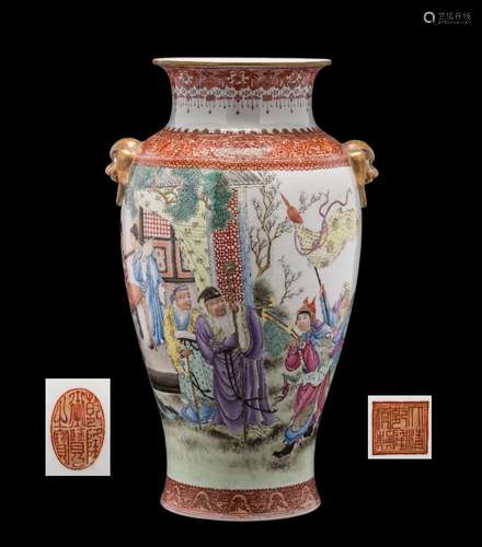 A Chinese famille rose baluster vase: with gilt lion dog ring handles,