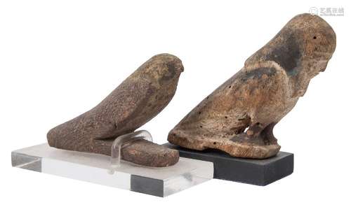 A carved wooden figure of Horus: as a falcon with some traces of decoration,