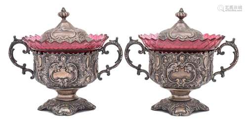 A pair of late 19th century German silver pedestal bowls and covers: each of circular outline,