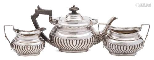 A Victorian bachelor's silver three-piece tea service, maker Henry Atkin, Sheffield,