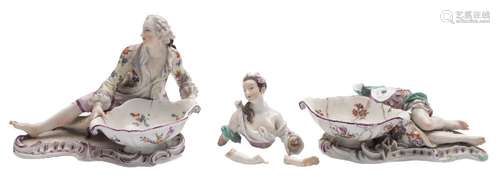 A pair of Meissen figural salts: in the form of a reclining gallant and female companion wearing