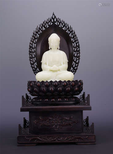 CHINESE YELLOW JADE SEATED BUDDHA ON ROSEWOOD STAND