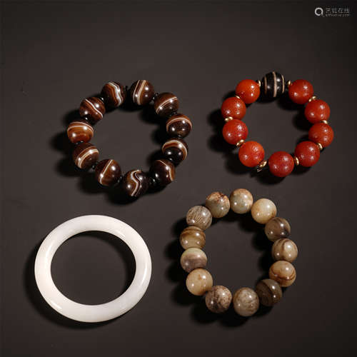 FOUR CHINESE AGATE BEAD JADE BANGLES