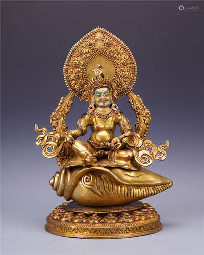 TIBETAN GILT BRONZE SEATED GOD OF WEALTH ON SNAIL