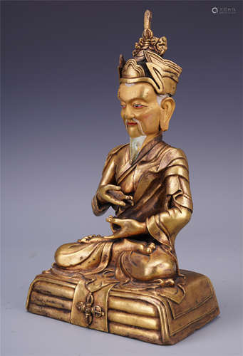 TIBETAN GILT BRONZE SEATED GURU