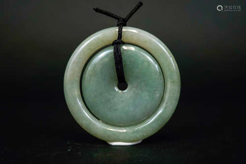 A JADEITE DOUBLE AUSPICIOUS KNOT PENDANT