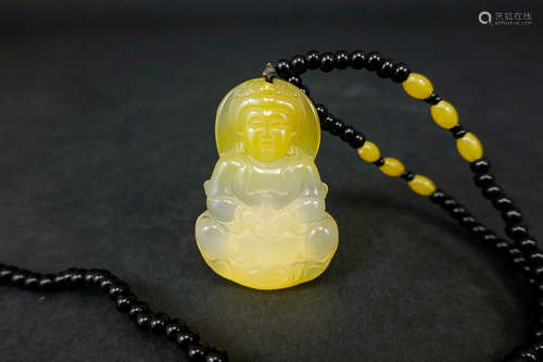 A YELLOW JADE GUANYIN PENDANT