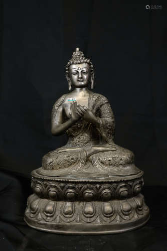 A COPPER SITTING BUDDHA