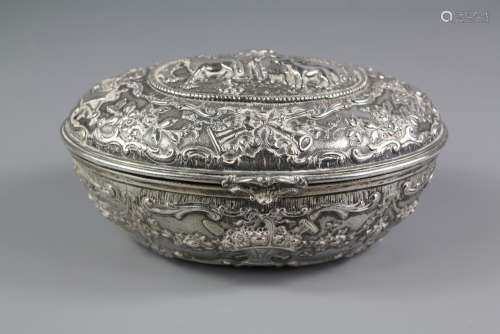 A Continental Silver Embossed Trinket Box: the box of oval form with embossed flowers and figures, hinged lid carries a central cartouche with a shepherd and his flock, approx 16 x 11 x 8 cms, marks to base, together with a silver 'love token' brooch