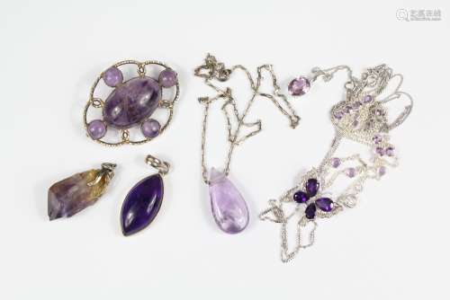 Amethyst Jewellery - A collection of five silver-mounted amethyst pendants, three on silver chains together with an amethyst and silver chain necklace approx 50 cms and brooch