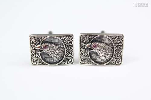 A Pair of Gentleman's Silver Cuff-links; the cuff-links depicting birds of prey with ruby eyes, approx 15