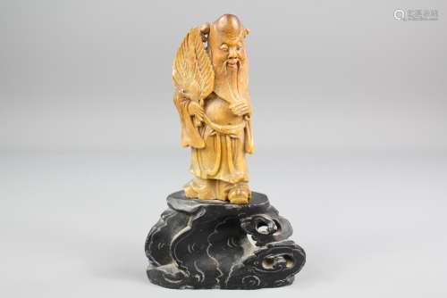 A Chinese Red Soapstone Carving depicting a Sage, approx 21 cms