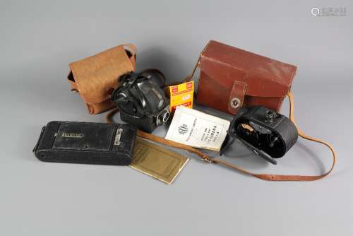 A Collection of Cameras; the lot comprises a 'Dekko' Double 8 mm' Cine Camera Model 110, with instruction book and film, an Ensign (Made in England) 'Ful-Vue