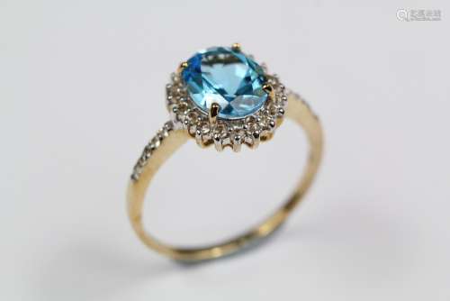 A 9ct Yellow Gold Blue and White Stone Ring