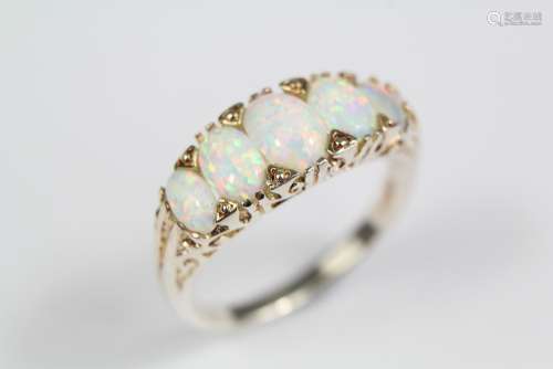 A Lady's Silver Dress Ring; the ring having five graduated opals, size Q, approx 3