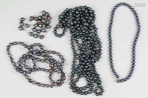 A Black Pearl Necklace: a long black pearl necklace, pearls approx 5 mm, 240 cms  with a pearl necklace, pearls approx 7 mms, approx 96 cms and a single-strand on 925 clasp, pearls approx 7 mm, approx 40 cms, together with a black pearl and silver metal chain necklace, approx 120 cms