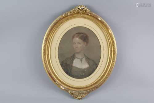 A Victorian Oval Pastel Portrait, depicting a young woman, indistinct signature dated 1860, framed and glazed