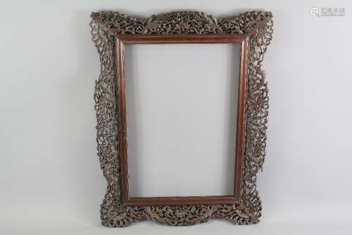 A Chinese Wood Carved Frame, approx 45 w x 60 h cms, the frame carved with chasing dragon