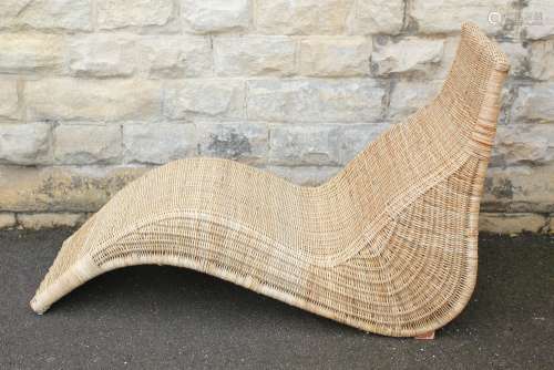A Rattan Lounger: The lounger measures approx 73 x 141 x 87 cms, together with a bamboo and rattan 