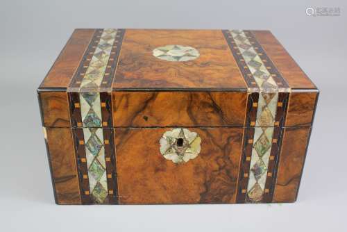 A Walnut and Mother-of-Pearl Box; the box decorated with mother-of-pearl bands and a central star to top and front, approx 30