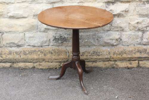 A Mahogany Tilt-top Occasional Table, the table with central support column on tripod feet, approx 75 cms dia x 7 cms h