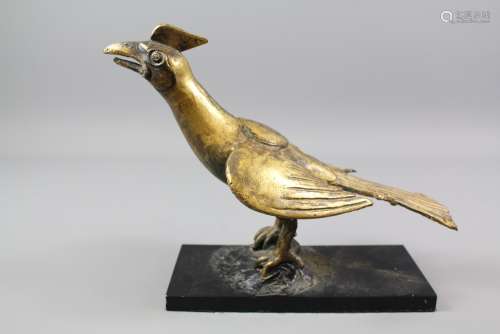 An Antique Gilt Bronze Model of a Winged Bird; the bird with a seal on its back, approx 24 x 20 cms