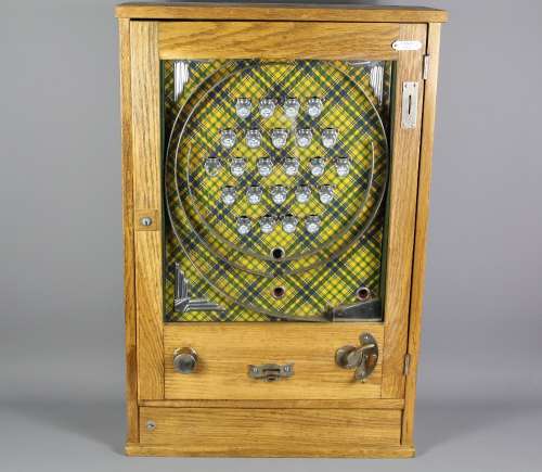 An Oak Cased Pier-side Penny Slot Machine; the machine approx 55 x 17 x 83 cms