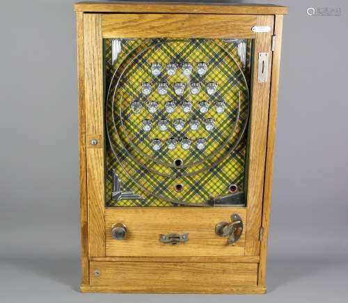 An Oak Cased Pier-side Penny Slot Machine; the machine approx 55 x 17 x 83 cms