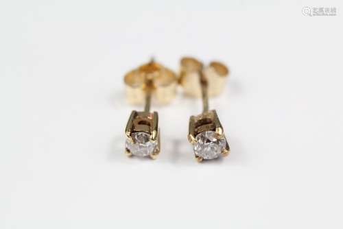 A Pair of Solitaire Diamond Earrings, the diamonds set on 9ct gold backs, approx 0