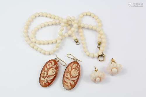 Miscellaneous Jewellery, this lot includes a white coral beaded necklace on gold-metal clasp, measurement: 45 cm (Ravello Italy) together with two 18ct gold oval cameo earrings, yellow gold loops approx 7 grams in weight, measurements 30 x 17 cms together with a pair of coral floral earrings