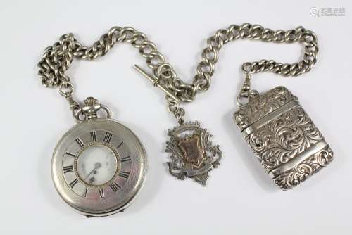 A Silver Half-hunter Pocket Watch; the watch on silver fob chain with 9ct gold and silver medallion and vesta case