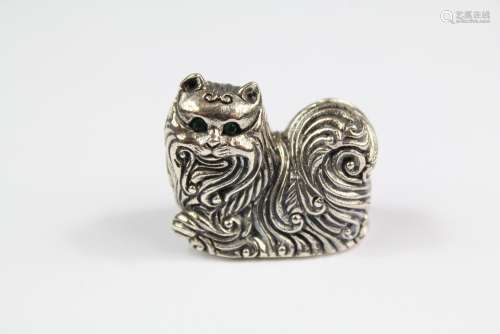 A Cast Silver Figure of a Seated Cat; the cat having emerald eyes, approx 28 x 23 mm, approx 20 gms