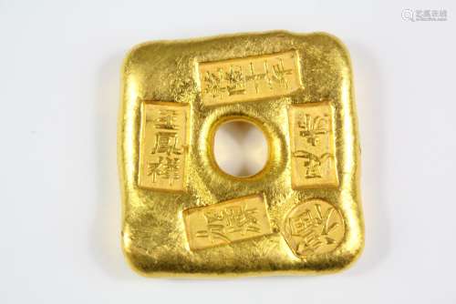 A Chinese Gilt Trade Token, approx 4 x 4 cms, with Chinese character marks