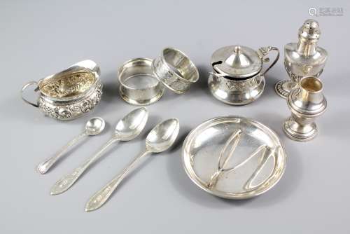 Miscellaneous Silver, this lot includes silver mustard pot, two napkin rings, bon bon dish, two teaspoons and a salt spoon and a salt and pepper together with a miniature cream jug, various hallmarks