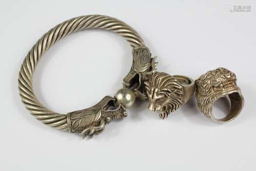 Two Chinese White Metal Rings together with a bangle depicting dragons chasing a pearl of wisdom