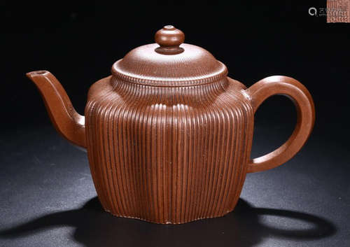 A PURPLE CLAY TEAPOT