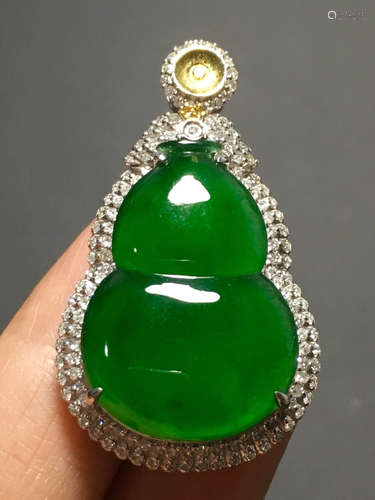 A ICY GREEN JADEITE CARVED GOURD PENDANT , TYPE A