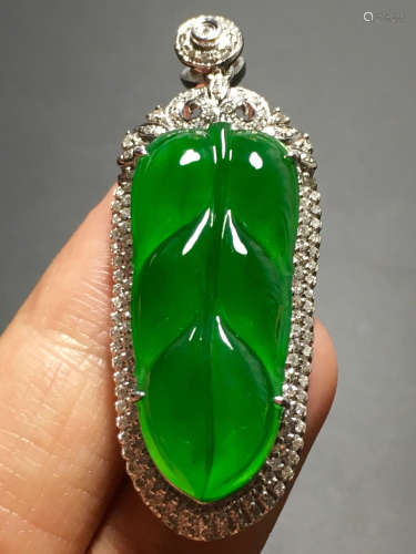 A ICY GREEN JADEITE CARVED LEAF PENDANT , TYPE A