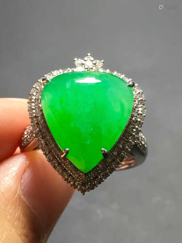 A ICY GREEN JADEITE CARVED HEART RING , TYPE A