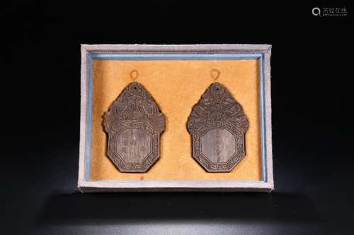 A PAIR OF CHENXIANG WOOD CARVED PATTERN TABLETS