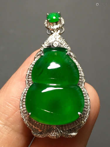 A ICY GREEN JADEITE CARVED GOURD PENDANT , TYPE A