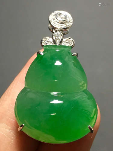 A ICY GREEN JADEITE CARVED GOURD PENDANT , TYPE A