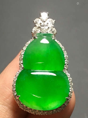 A ICY GREEN JADEITE CARVED GOURD PENDANT , TYPE A