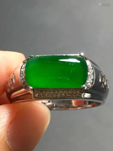 A ICY GREEN JADEITE CARVED SADDLE RING , TYPE A