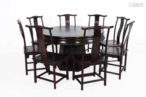 A SET OF ZITAN WOOD 'YUNFUPENGSHOU'PATTERN ROUND TABLE AND EIGHT CHAIRS