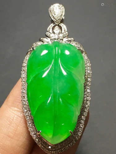 A ICY GREEN JADEITE CARVED LEAF PENDANT , TYPE A