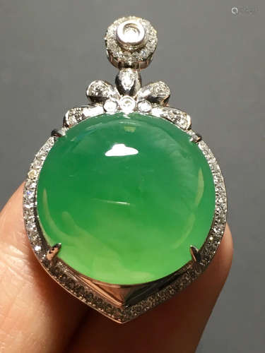 A ICY GREEN JADEITE CARVED CIRCLE  PENDANT , TYPE A